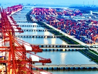 The container terminal of Taicang Port Phase 4 is being illuminated in Suzhou, Jiangsu province, China, on the evening of July 9, 2024. (