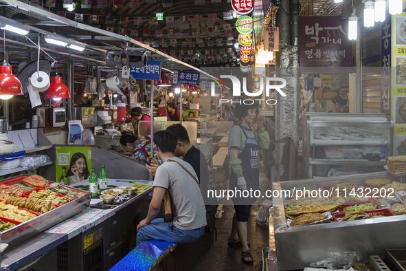 A general view is showing the South Korean traditional food court at Gwangjang Market in Seoul, South Korea. Gwangjang Market is being a tra...