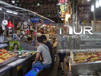 A general view is showing the South Korean traditional food court at Gwangjang Market in Seoul, South Korea. Gwangjang Market is being a tra...