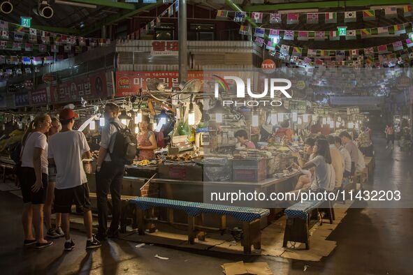 A general view is showing the South Korean traditional food court at Gwangjang Market in Seoul, South Korea. Gwangjang Market is being a tra...