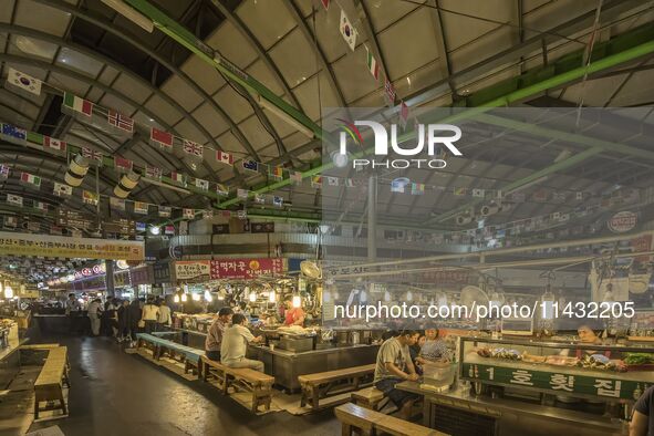 A general view is showing the South Korean traditional food court at Gwangjang Market in Seoul, South Korea. Gwangjang Market is being a tra...