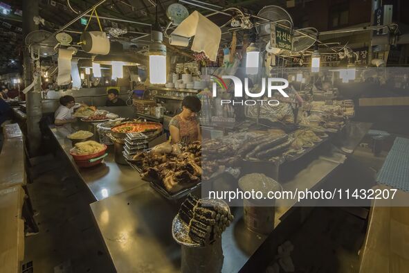 A general view is showing the South Korean traditional food court at Gwangjang Market in Seoul, South Korea. Gwangjang Market is being a tra...