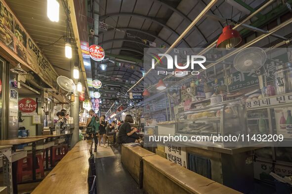 A general view is showing the South Korean traditional food court at Gwangjang Market in Seoul, South Korea. Gwangjang Market is being a tra...