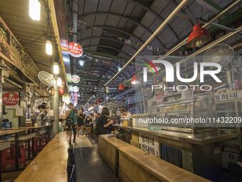 A general view is showing the South Korean traditional food court at Gwangjang Market in Seoul, South Korea. Gwangjang Market is being a tra...