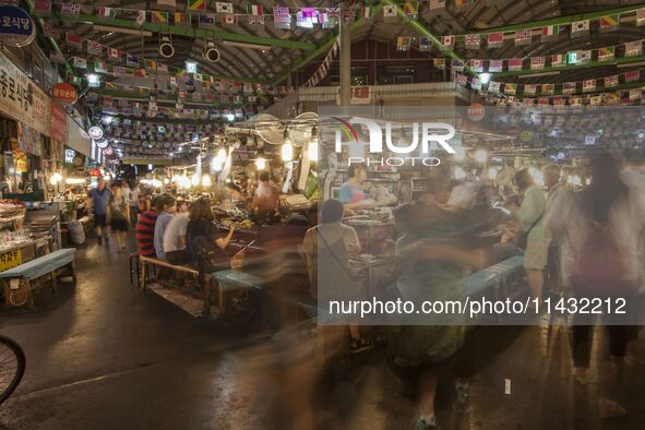 A general view is showing the South Korean traditional food court at Gwangjang Market in Seoul, South Korea. Gwangjang Market is being a tra...