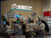 Customers are shopping at a Freshippo store in the Huangpu district of Shanghai, China, on July 25, 2024. (