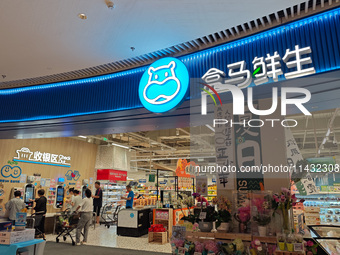 Customers are shopping at a Freshippo store in the Huangpu district of Shanghai, China, on July 25, 2024. (