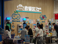 Customers are shopping at a Freshippo store in the Huangpu district of Shanghai, China, on July 25, 2024. (