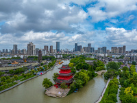 An aerial photo is showing urban buildings under the blue sky and white clouds in Huai'an City, East China's Jiangsu province, on July 25, 2...