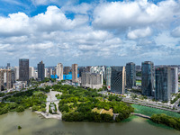 An aerial photo is showing urban buildings under the blue sky and white clouds in Huai'an City, East China's Jiangsu province, on July 25, 2...