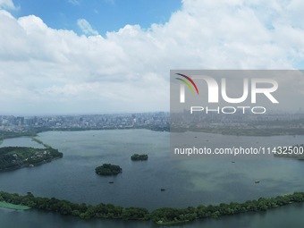 Winds and clouds are rising above the West Lake affected by Typhoon Kaemi in Hangzhou, China, on July 25, 2024. (