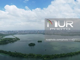 Winds and clouds are rising above the West Lake affected by Typhoon Kaemi in Hangzhou, China, on July 25, 2024. (