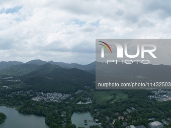 Winds and clouds are rising above the West Lake affected by Typhoon Kaemi in Hangzhou, China, on July 25, 2024. (