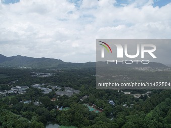 Winds and clouds are rising above the West Lake affected by Typhoon Kaemi in Hangzhou, China, on July 25, 2024. (