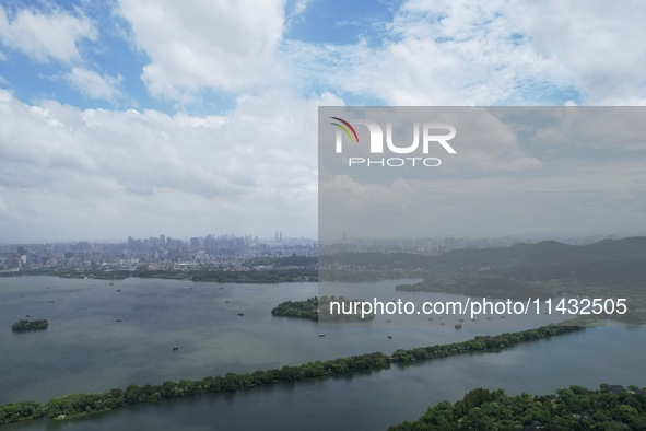 Winds and clouds are rising above the West Lake affected by Typhoon Kaemi in Hangzhou, China, on July 25, 2024. 