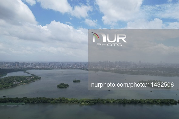 Winds and clouds are rising above the West Lake affected by Typhoon Kaemi in Hangzhou, China, on July 25, 2024. 