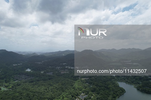 Winds and clouds are rising above the West Lake affected by Typhoon Kaemi in Hangzhou, China, on July 25, 2024. 