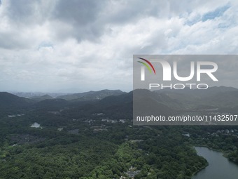 Winds and clouds are rising above the West Lake affected by Typhoon Kaemi in Hangzhou, China, on July 25, 2024. (