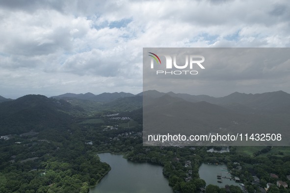 Winds and clouds are rising above the West Lake affected by Typhoon Kaemi in Hangzhou, China, on July 25, 2024. 