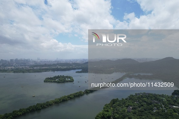 Winds and clouds are rising above the West Lake affected by Typhoon Kaemi in Hangzhou, China, on July 25, 2024. 