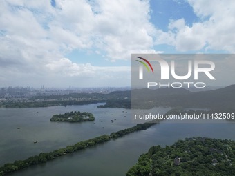 Winds and clouds are rising above the West Lake affected by Typhoon Kaemi in Hangzhou, China, on July 25, 2024. (