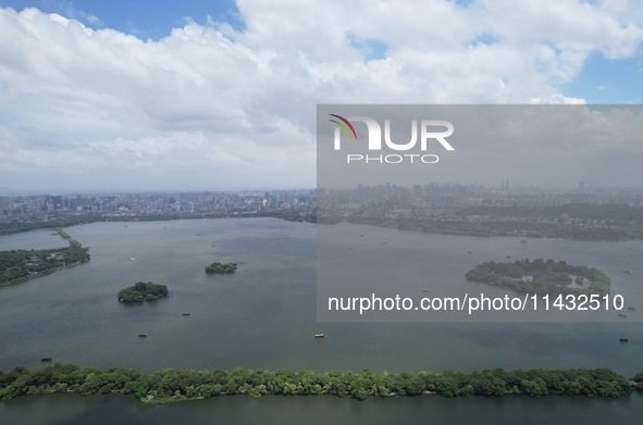 Winds and clouds are rising above the West Lake affected by Typhoon Kaemi in Hangzhou, China, on July 25, 2024. 