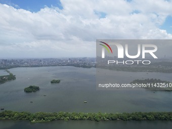 Winds and clouds are rising above the West Lake affected by Typhoon Kaemi in Hangzhou, China, on July 25, 2024. (