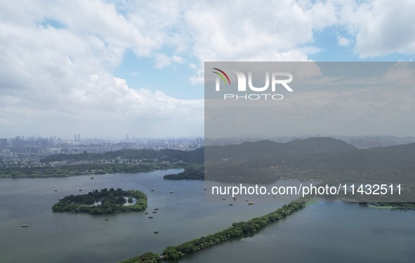 Winds and clouds are rising above the West Lake affected by Typhoon Kaemi in Hangzhou, China, on July 25, 2024. 