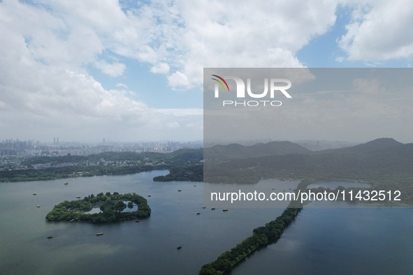 Winds and clouds are rising above the West Lake affected by Typhoon Kaemi in Hangzhou, China, on July 25, 2024. 