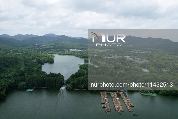 Winds and clouds are rising above the West Lake affected by Typhoon Kaemi in Hangzhou, China, on July 25, 2024. 