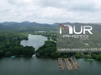 Winds and clouds are rising above the West Lake affected by Typhoon Kaemi in Hangzhou, China, on July 25, 2024. (