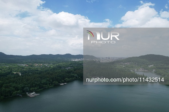 Winds and clouds are rising above the West Lake affected by Typhoon Kaemi in Hangzhou, China, on July 25, 2024. 