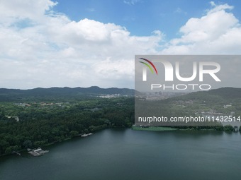 Winds and clouds are rising above the West Lake affected by Typhoon Kaemi in Hangzhou, China, on July 25, 2024. (