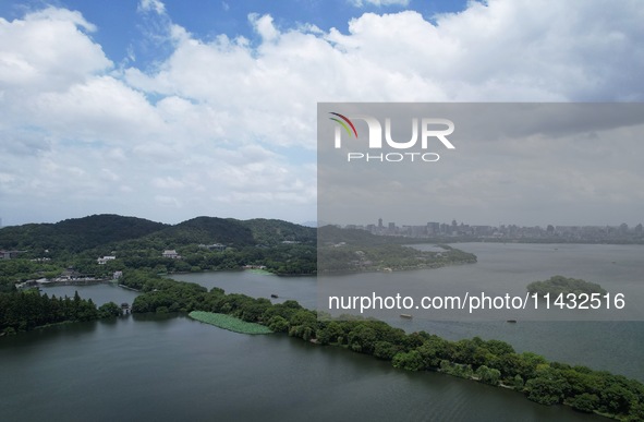 Winds and clouds are rising above the West Lake affected by Typhoon Kaemi in Hangzhou, China, on July 25, 2024. 