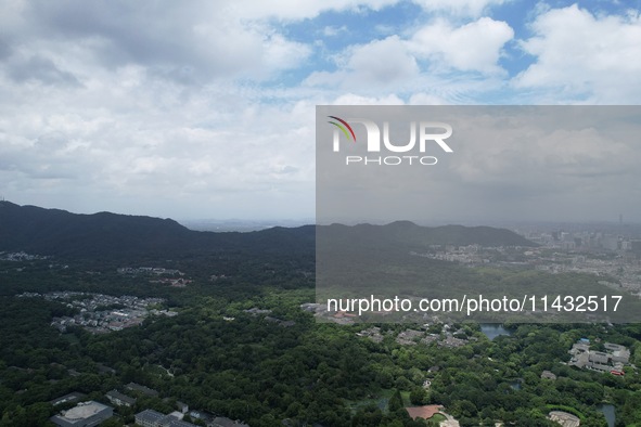 Winds and clouds are rising above the West Lake affected by Typhoon Kaemi in Hangzhou, China, on July 25, 2024. 