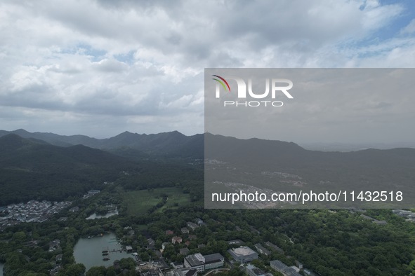 Winds and clouds are rising above the West Lake affected by Typhoon Kaemi in Hangzhou, China, on July 25, 2024. 