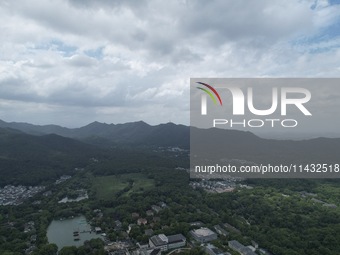 Winds and clouds are rising above the West Lake affected by Typhoon Kaemi in Hangzhou, China, on July 25, 2024. (