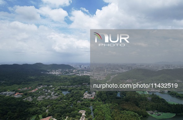 Winds and clouds are rising above the West Lake affected by Typhoon Kaemi in Hangzhou, China, on July 25, 2024. 