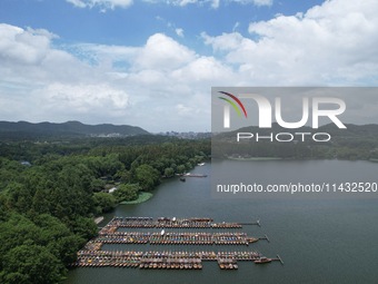 Winds and clouds are rising above the West Lake affected by Typhoon Kaemi in Hangzhou, China, on July 25, 2024. (