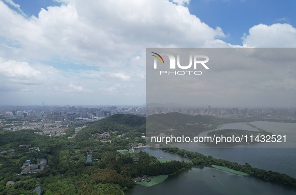 Winds and clouds are rising above the West Lake affected by Typhoon Kaemi in Hangzhou, China, on July 25, 2024. 