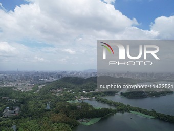 Winds and clouds are rising above the West Lake affected by Typhoon Kaemi in Hangzhou, China, on July 25, 2024. (