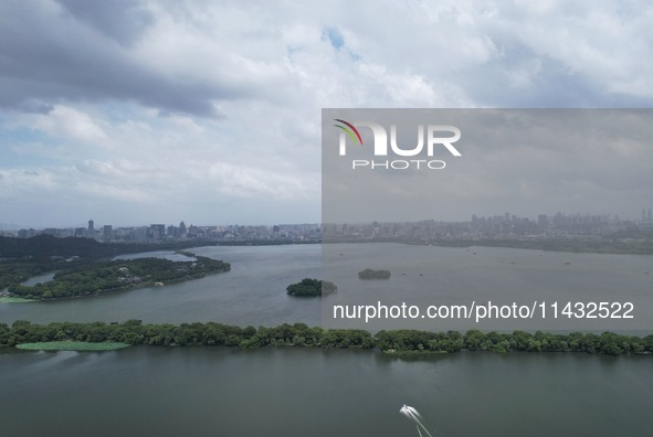 Winds and clouds are rising above the West Lake affected by Typhoon Kaemi in Hangzhou, China, on July 25, 2024. 