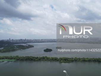 Winds and clouds are rising above the West Lake affected by Typhoon Kaemi in Hangzhou, China, on July 25, 2024. (