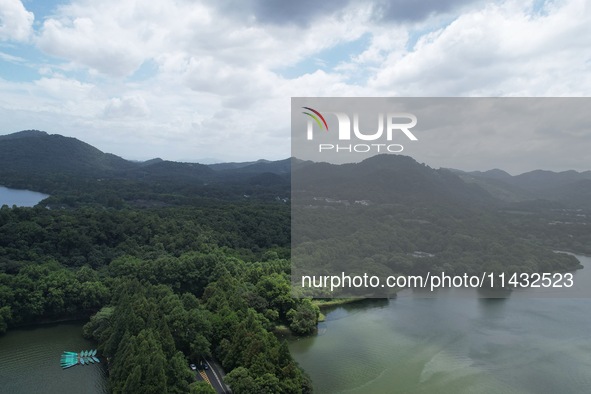 Winds and clouds are rising above the West Lake affected by Typhoon Kaemi in Hangzhou, China, on July 25, 2024. 