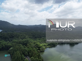 Winds and clouds are rising above the West Lake affected by Typhoon Kaemi in Hangzhou, China, on July 25, 2024. (