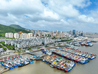 Boats are taking shelter from Typhoon Kaemi at Shenjiamen Fishing Port in Putuo district of Zhoushan city, East China's Zhejiang province, i...