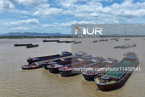 Cargo ships are anchoring in the waters of the Nanjing section of the Yangtze River in Nanjing, Jiangsu province, China, on July 25, 2024. O...