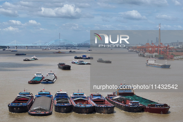 Cargo ships are anchoring in the waters of the Nanjing section of the Yangtze River in Nanjing, Jiangsu province, China, on July 25, 2024. O...