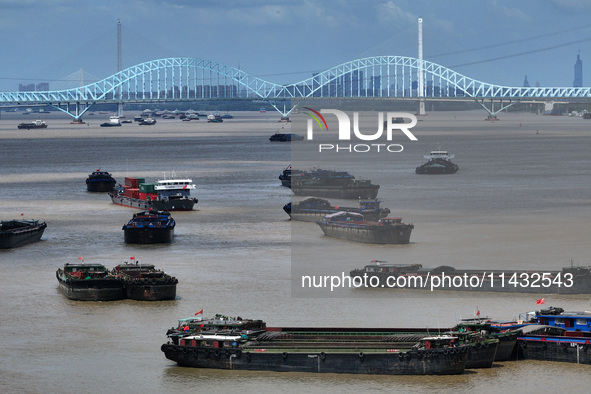 Cargo ships are anchoring in the waters of the Nanjing section of the Yangtze River in Nanjing, Jiangsu province, China, on July 25, 2024. O...