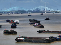 Cargo ships are anchoring in the waters of the Nanjing section of the Yangtze River in Nanjing, Jiangsu province, China, on July 25, 2024. O...